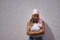 Portrait of young and beautiful woman, with a pink scarf of the fight against cancer, with sad gesture and looking down. Concept Royalty Free Stock Photo