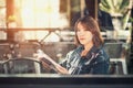 Young woman reads and listens to music Royalty Free Stock Photo