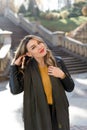 Portrait of young beautiful woman with red lipstick and long blonde curled hair Royalty Free Stock Photo