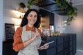 Portrait of young beautiful woman small business owner of coffee shop and cafe restaurant, Hispanic woman smiling and Royalty Free Stock Photo