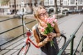 Woman with tulips in Amsterdam city Royalty Free Stock Photo