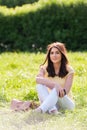 Portrait of young beautiful woman in summer city park. Royalty Free Stock Photo