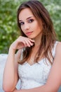 Portrait of a young beautiful woman in a white corset and with large white angel wings behind her back Royalty Free Stock Photo