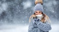 Portrait of young beautiful woman in winter clothes and strong snowing