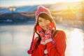 Portrait of a young beautiful woman in winter in a hat in the sun Royalty Free Stock Photo