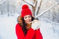 Portrait of young beautiful woman on winter outdoor background. Drinking coffee and enjoying life. Royalty Free Stock Photo