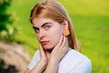 Portrait of a young beautiful woman with wooden tunnels in her e