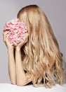 Portrait of young beauty female with blond hair and hydrangea bo