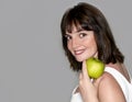 Portrait of young beauty woman with green apple Royalty Free Stock Photo