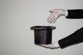 Portrait of young black Illusionist magician doing magic with a top hat Royalty Free Stock Photo