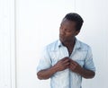 Portrait of a young black man adjusting shirt button outdoors Royalty Free Stock Photo