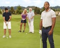 Portrait of young black man on golf course Royalty Free Stock Photo