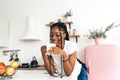 Portrait of young black woman drinking a cup of coffee or tea in the morning Royalty Free Stock Photo