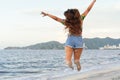 Portrait of a young black woman having fun at beach - Happy female enjoying sunset by the sea - Beauty, positive and happy Royalty Free Stock Photo