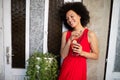 Portrait of a young black woman, model of fashion wearing dress with afro hairstyle Royalty Free Stock Photo