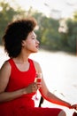 Portrait of a young black woman, model of fashion wearing dress with afro hairstyle Royalty Free Stock Photo