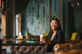 Portrait of a young black woman smiling and using laptop Royalty Free Stock Photo