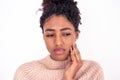 Black girl face portrait suffering toothache on white background