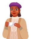 Portrait of young black woman wearing lilac beret and sweater. Cute girl holding a cup of tea Royalty Free Stock Photo