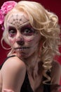 Portrait of young blond girl with Calaveras makeup Royalty Free Stock Photo