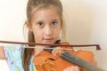 Portrait of a young blond teenage girl playing violin. Girl playing the violin Royalty Free Stock Photo