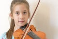 Portrait of a young blond teenage girl playing violin. Girl playing the violin Royalty Free Stock Photo