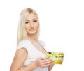 Portrait of a young blond woman holding a salad Royalty Free Stock Photo