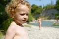 Portrait of a young blonde boy on the beach Royalty Free Stock Photo