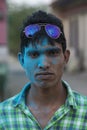 Portrait of a young Boy with colourful Face at Nandgaon Temple during Holi Festival,Uttarpradesh,India Royalty Free Stock Photo