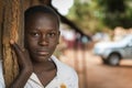 Portrait of a young boy at the entrance of his home in the town of Nhacra in Guinea Bissau