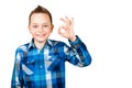 Portrait of young boy laugh and show the OK sign on a white isolated background Royalty Free Stock Photo