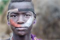 Portrait of a young boy from Mursi tribe, Ethiopia