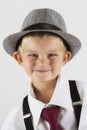 Portrait of a young boy with old hat being funny Royalty Free Stock Photo