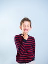 Portrait of a young boy pointing at his missing tooth Royalty Free Stock Photo
