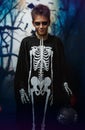 Portrait of young boy in skeleton costume with makeup. Celebration of holiday Halloween, the boy in the image, the skeleton theme Royalty Free Stock Photo