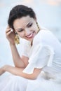 Portrait young bride with brunette hair in white wedding dress a Royalty Free Stock Photo