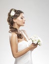 Portrait of a young bride holding white roses Royalty Free Stock Photo