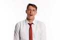 Portrait of a young brunet man posing in a studio isolated over a white background. Royalty Free Stock Photo