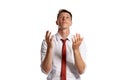 Portrait of a young brunet man posing in a studio isolated over a white background. Royalty Free Stock Photo