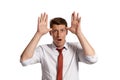 Portrait of a young brunet man posing in a studio isolated over a white background. Royalty Free Stock Photo