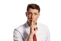 Portrait of a young brunet man posing in a studio isolated over a white background. Royalty Free Stock Photo