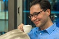 Portrait of young brunette hair businessman sitting in a coffee Royalty Free Stock Photo