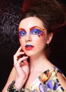 Portrait of young brunette woman with artistic make-up, close up. Beauty concept.