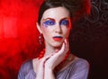 Portrait of young brunette woman with artistic make-up, close up. Beauty concept.