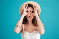 Portrait of a young brunette woman in beach hat Royalty Free Stock Photo