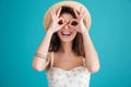 Portrait of a young brunette woman in beach hat Royalty Free Stock Photo