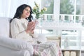 Portrait of young brunette woman drinking tea Royalty Free Stock Photo