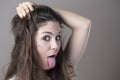 Portrait of a young brunette woman making faces with different e Royalty Free Stock Photo