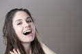 Portrait of a young brunette woman making faces with different e Royalty Free Stock Photo