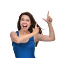 Portrait of young brunette woman pointing hands finger at corner Royalty Free Stock Photo